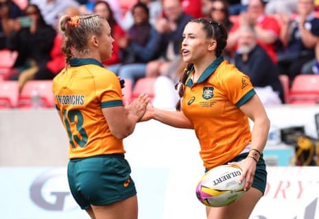 Australia's Desiree Miller celebrates with Georgina Friedrichs after scoring their second try.