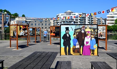 Information displays on a quay and a mural of Brunel and others in which people can pose in face holes for a photo