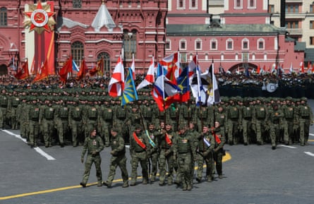 Russian soldiers march in columns during a parade on Victory Day