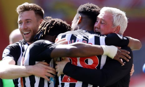 Newcastle United’s Joe Willock celebrates equalising at Liverpool with manager Steve Bruce, Allan Saint-Maximin and Paul Dummett