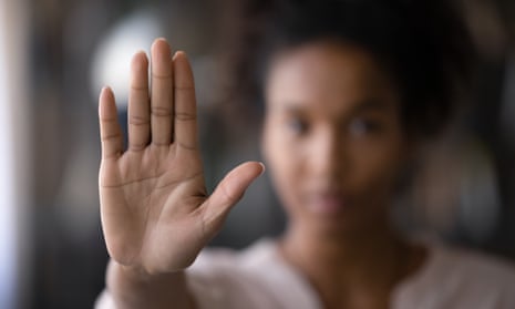 Crop,Close,Up,Focus,Of,African,American,Woman,Show,PalmCrop close up focus of African American woman show palm hand against racial gender discrimination. Determined mixed race female make sign gesture protest against domestic violence or abortion.; Shutterstock ID 2025356663; purchase_order: -; job: -; client: -; other: -