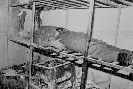 a person laying down on a torture contraption