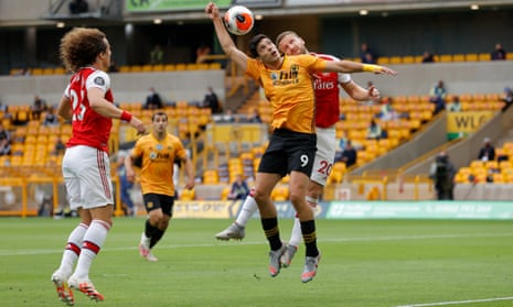 Raul Jiminez of Wolves and Shkodran Mustafi of Arsenal go up for a header.