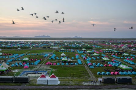 Birds fly over the World Scout Jamboree campsite in Buan, South Korea