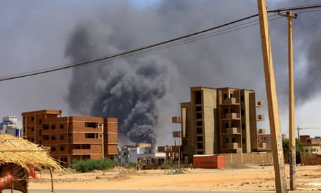 Smoke rises above buildings after a previous airstrike on the Sudanese capital