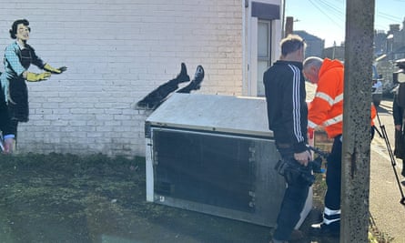 Freezer is removed from the Banksy artwork, titled ‘Valentine’s Day Mascara’, installed on the side of a building in Margate, Kent.