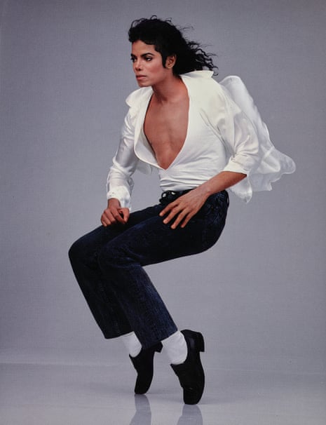 Action portrait of American singer and songwriter Michael Jackson wearing a white shirt and black pants