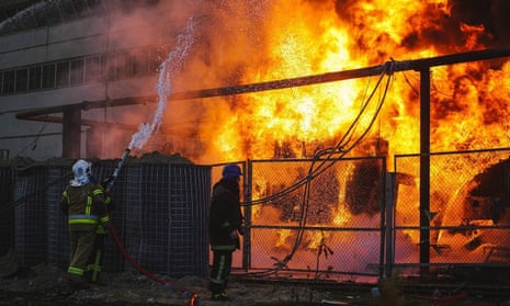 Members of emergency services respond to a fire after a Russian attack targeted energy infrastructure in Kyiv, Ukraine.