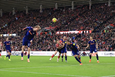 Nick Woltemade stretches to defend a cross and heads into his own goal.