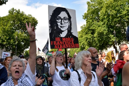 Crowds of pro-Palestine supporters gather at Whitehall to listen to guest speakers during the National March for Palestine. A woman in the crowd holds a plackard that reads ‘Be more Francesca Albanese!!!’