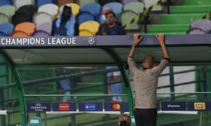 Pep Guardiola looks dejected as the game slips away from Manchester City.