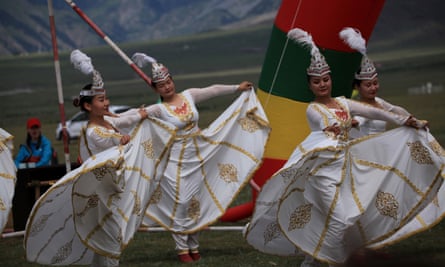 Women dressed in ethnic Kazakh costumes perform during a grassland festival in Bortala Mongol, Xinjiang.