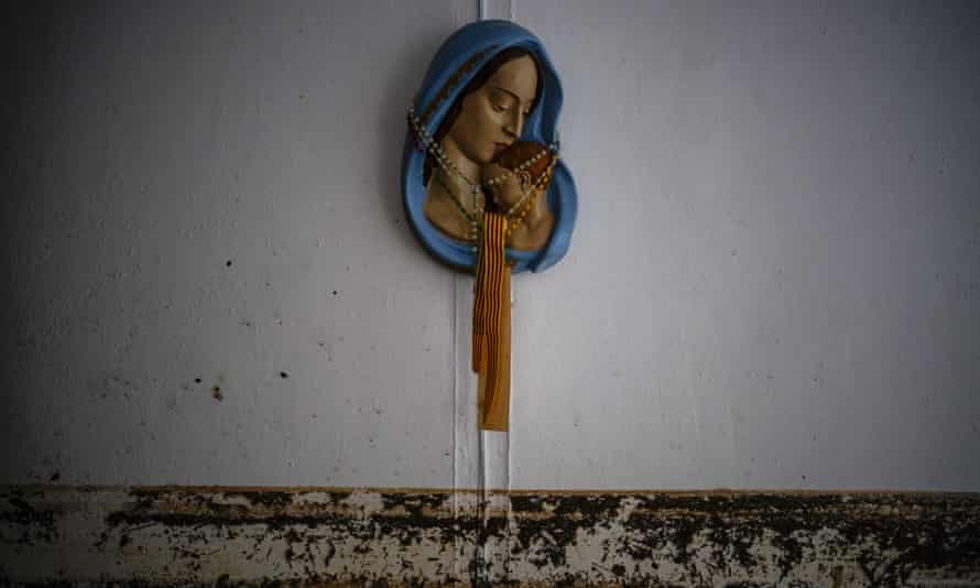 A line of mud on a wall marks the flood level inside a home in Alcanar