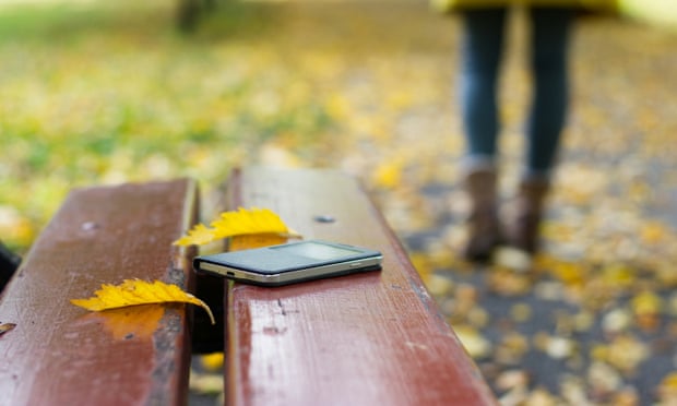 smart phone on a bench in park