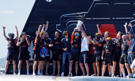 Ineos Britannia’s Ben Ainslie, crew members and Chairman and Chief Executive Officer of INEOS, Jim Ratcliffe celebrate with the trophy after winning round 11 and the final against Luna Rossa Prada Pirelli