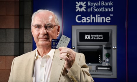 ATM inventor James Goodfellow with one of the early ‘coded bank tokens’ and a modern day card