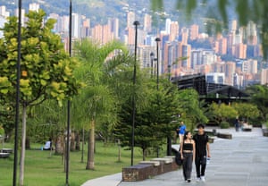 People walk in Parques del Rio in Medellín