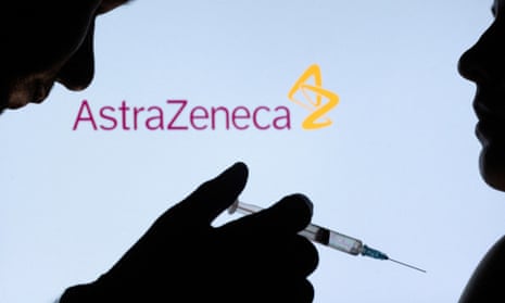 A vaccine syringe held by one silhouetted figure towards another in front of an AstraZeneca logo.