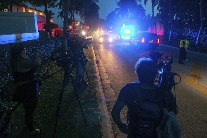 Media stand outside Mar-A-Lago in Palm Beach, Florida, on Monday night.