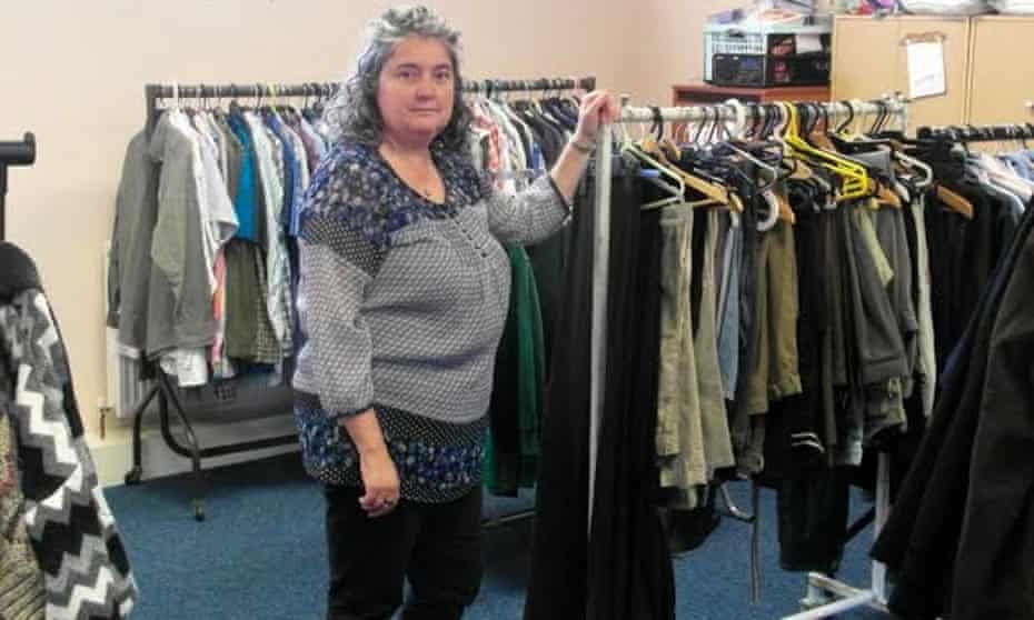 Louise Cooke of Sharewear clothes bank next to clothes rails