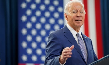 Joe Biden speaking, with a US flag in background