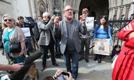 A small group of activists including a US cleric supporting Charlie Gard’s parent hold a prayer vigil outside the high court in London on Sunday.
