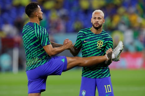 Brazil's Neymar (right) warms up ahead of the FIFA World Cup Qatar 2022 Round of 16 match between Brazil and South Korea at Stadium 974.