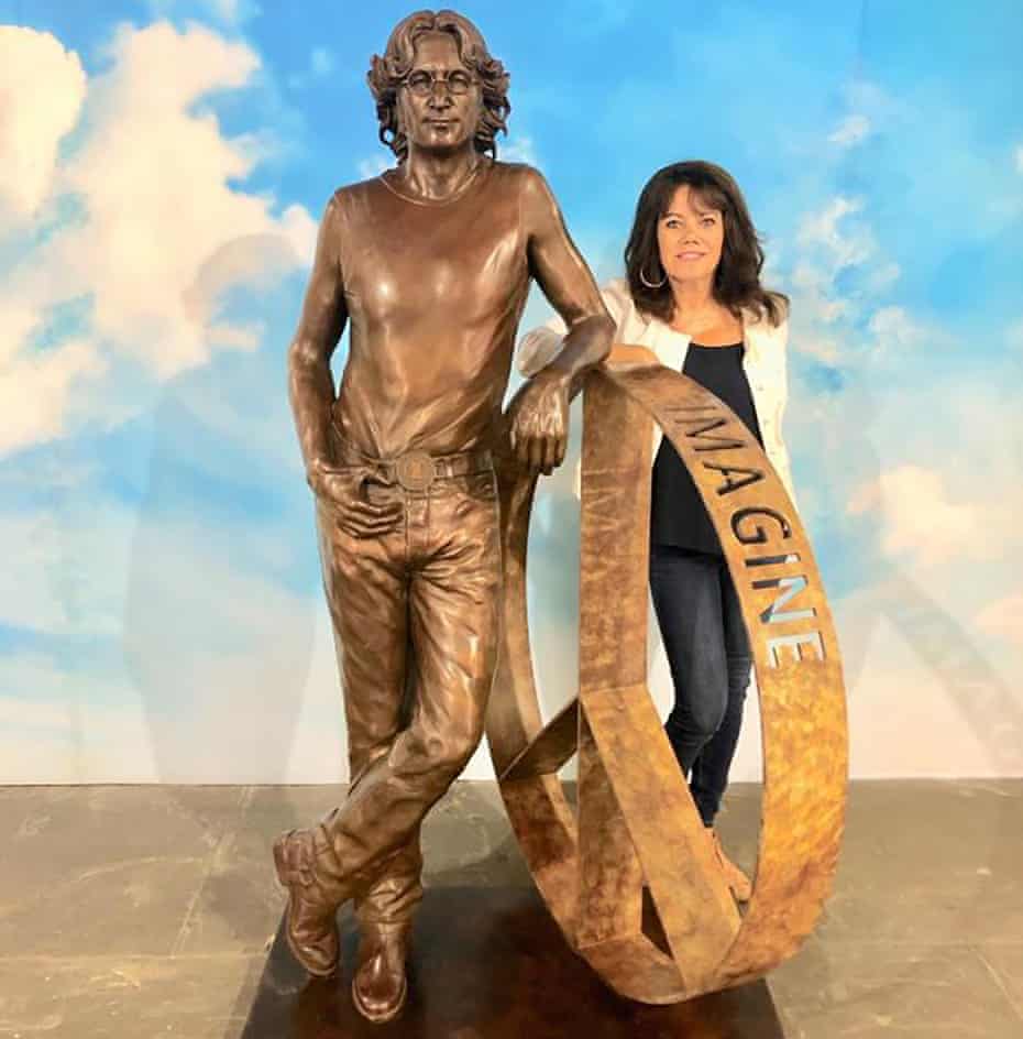 Laura Lian is seen with her John Lennon statue