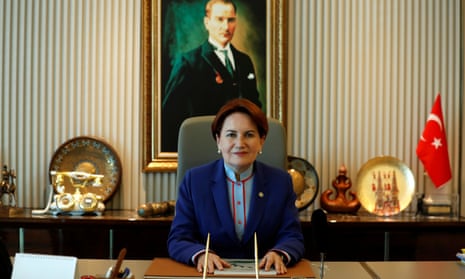 Meral Aksener sits in front of a portrait of the founder of the Turkish republic, Mustafa Kemal Ataturk, in the Ankara headquarters of her İyi (Good) party