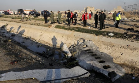 Wreckage at the crash site outside Tehran, which is being rapidly cleared
