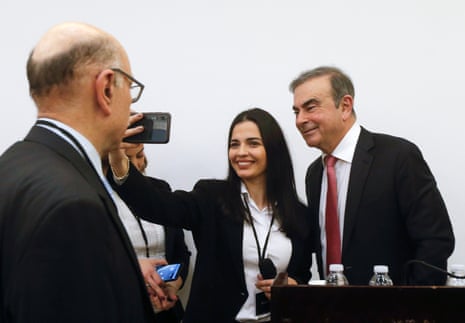 Former Nissan chairman Carlos Ghosn poses for a selfie picture.