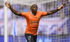 Jean Evrard Kouassi celebrates scoring for Wuhan Zall against Shanghai Greenland Shenhua last season.