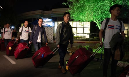 Thai nationals heading to a bus as they leave the Shamir hospital in Ramle, Israel