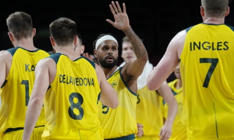 Patty Mills celebrates with his Australian teammates during the men’s basketball quarter-final