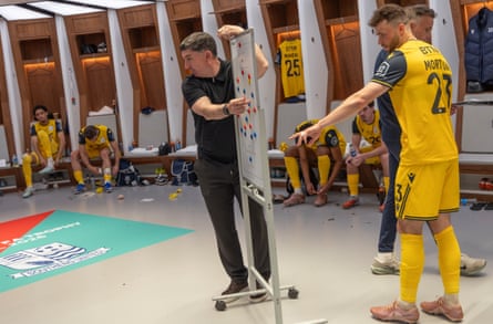 Kevin Maher calmly gives instructions to his team at half-time.