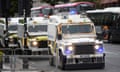 Line of armoured PSNI Land Rovers