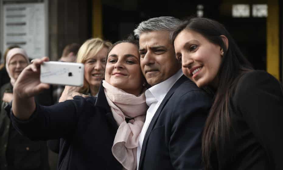 Sadiq Khan poses for a selfie with local resident Maribel Ares as he campaigns with Rosena Allin -Khan, (right) who has been selected at the new Labour Party candidate for Tooting.