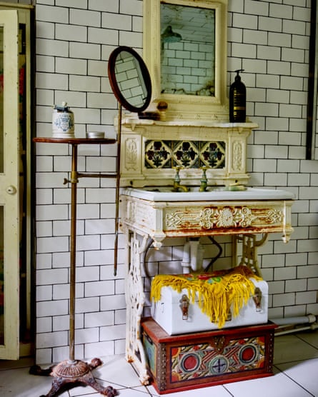 Mirror mirror: a reclaimed marble sink plumbed into an old iron table.