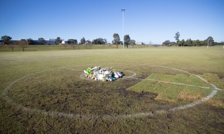 floral tributes at the centre of the field