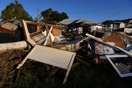Debris and flood damage on River Street in Taree on Saturday.