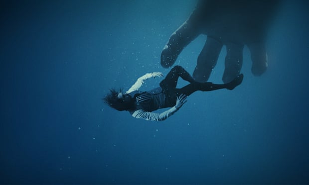 Giant hand reaches for actor underwater