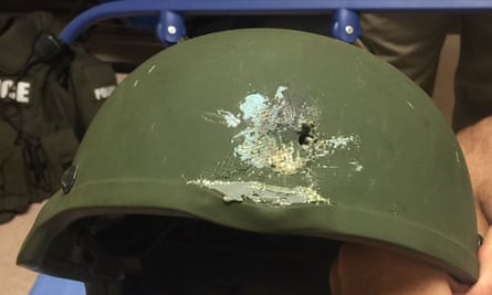 A bullet hole left in a Kevlar helmet worn by the Orlando police officer.