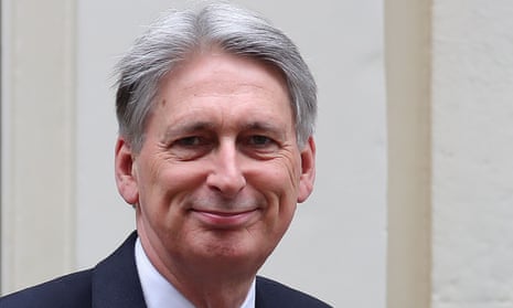 Philip Hammond leaves Downing Street to deliver the spring statement.