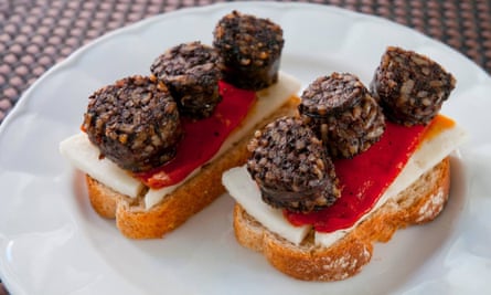 A typical pincho of morcilla with red pepper and cheese.