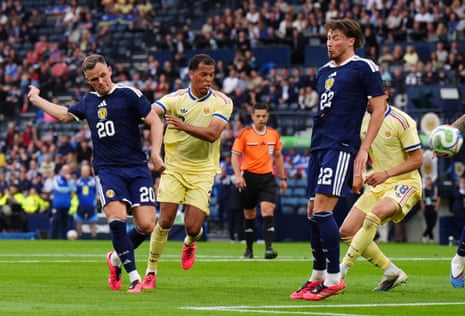 Scotland's Lawrence Shankland scores their side's second goal of the game.