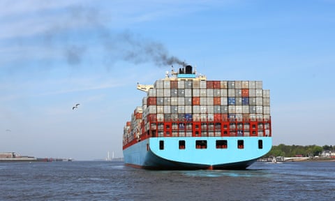 Smoke from the funnel of a container ship leaving the port of Hamburg