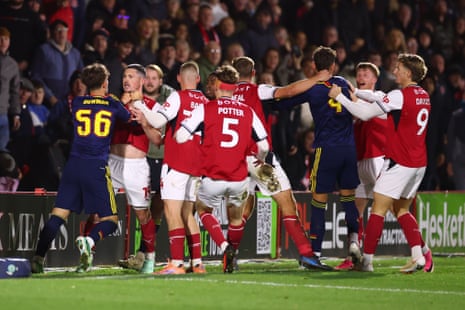 Arsenal and Fleetwood Town players clash on the pitch as teammates step in