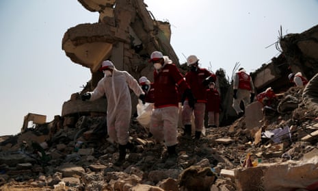 A rescue team searches for victims among the rubble of a building hit by airstrikes, in Dhamar province, Yemen, on 4 September 2019. 
