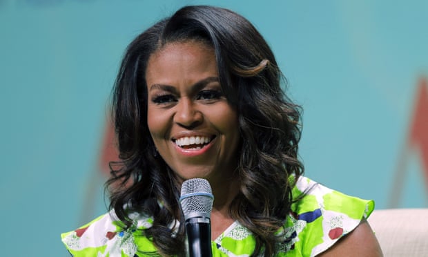 FILE - In this June 22, 2018 file photo, former first lady Michelle Obama speaks at the American Library Association annual conference in New Orleans. Obama is launching a book tour to promote her memoir “Becoming,” a tour featuring arenas and other performing centers to accommodate crowds likely far too big for any bookstore. (AP Photo/Gerald Herbert)