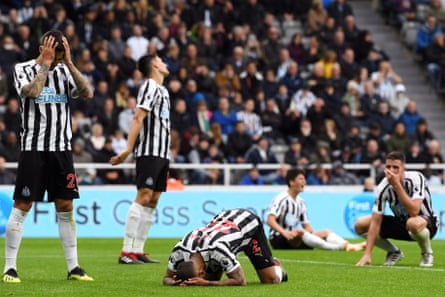 August 26: Deandre Yedlin of Newcastle United and his teammates look dejected after his own goal against Chelsea.